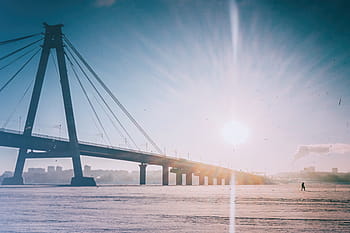 black bridge, person, walking, distant, bridge, high, rise, buildings, sea, ocean, blue