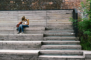 woman, sitting, brown, concrete, stairs, women, wearing, white, sleeveless, top, blue