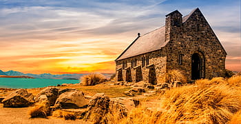 landscape photography, brown, black, brick church, middle, grass, body, water, golden, hour, body of water