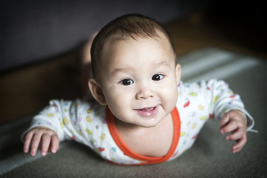 smiling, baby, wearing, white, orange, long-sleeved, top, shallow focus, onesie, boy, happy