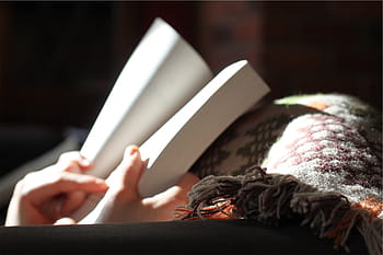 person holding book, person, holding, book, reading, indoors, adult, human hand, close-up, human body part, day