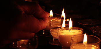 person lighting, votive, candles, tea lights, hand, church, light, prayer, candlelight, faith, religion