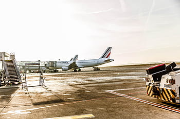 white, gray, airplane, pavement, daytime, truck, airport, tarmac, transportation, travel, trip