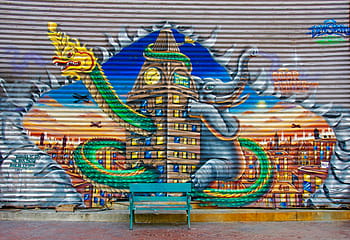 assorted-color mural, bench, daytime, graffiti, bank, wall, colorful, color, dragons, elephant, wood