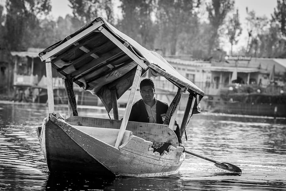 man, shikara, kashmir, dal lake, shikara ride, man in boat, floating market, meena bazaar, travel, street photography, boat ride