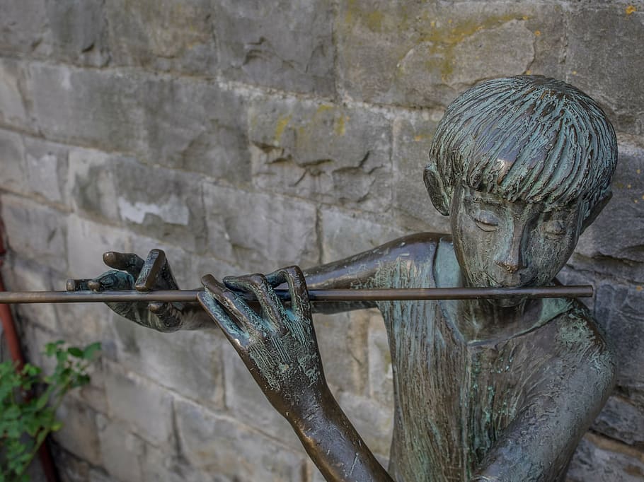flute, music, art, statue, instrument, woodwind, wall, landmark, artwork, cast, iron