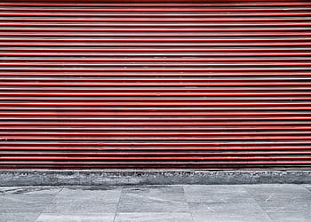 red, steel shutter door, store, closed, day, street, shop, pedestrian, outside, sidewalk, pattern