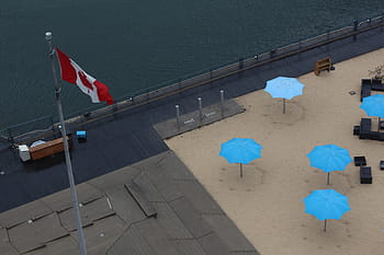 canada flag, gray, pole, flag, canada, shown, cottage, roof, sand, umbrella, sea