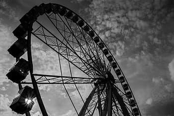giant ferris wheel, wheel, amusement park, black and white, sky, clouds, outdoor, structure, ride, entertainment, silhouette
