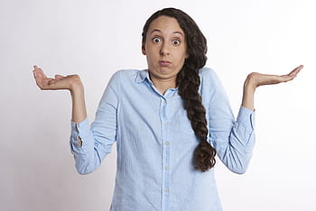 woman, wearing, blue, dress shirt, confused, hands, unsure, perplexed, young, expression, confusion
