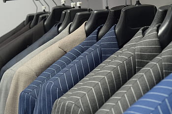 assorted-color hanged coat, suit, tie, men, in a row, large group of objects, indoors, coathanger, choice, close-up, day