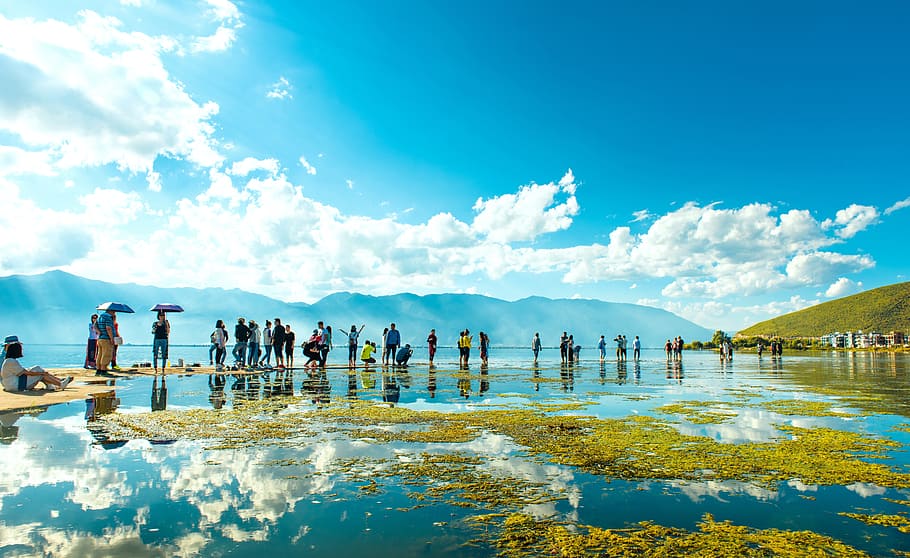 group, people, standing, shallow, body, water, mountains, cloudy, blue, sky, group of people