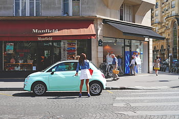 woman, standing, holding, blue, fiat 500, left, door parking, street, architecture, building, infrastructure