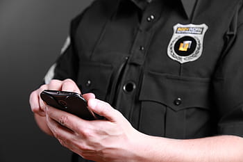 sheriff holding smartphone, bodyworn, body camera, police body camera, law enforcement, cops, law enforcing, policeman, police officer, technology, tech