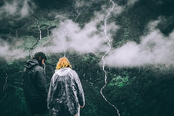 man, woman, wearing, hooded jacket, two, black, gray, windbreaker, jackets, mountain, top