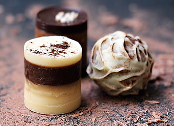two, cylindrical, round chocolates, chocolates, chocolate, confiserie, candy, nibble, chocolate praline, sweet, food