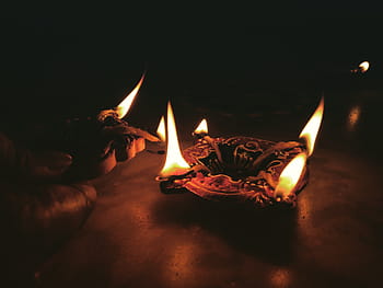 person lighting candles, candle, light, fire, flame, dark, night, ashtray, table, burning, heat - temperature