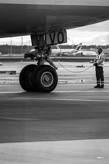 airplane, airport, runway, vehicle, aircraft, tarmac, road, wheel, people, airliner, man