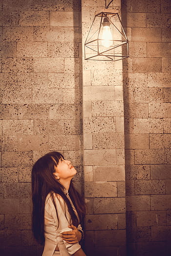 woman, looking, light bulb, turned, wall, people, girl, alone, light, bulb, one woman only