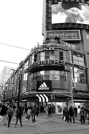 cineplex winners signboard, winners, building, grayscale, photography, monochrome, black and white, urban, city, people, man