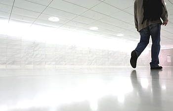 person, walking, room, man, wearing, gray, suit, jacket, dress, pants, pair