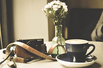 black, sony point-and-shoot camera, mug, sony, point, shoot, camera, white, petaled, flower, vase