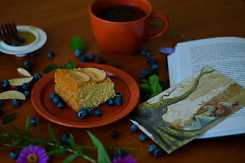 slice, cake, surrounded, blue, berries, served, plate, round, red, pastry, near
