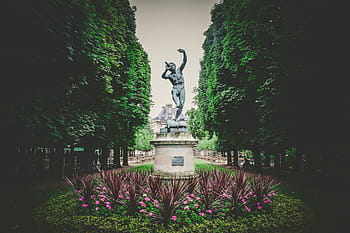 man statue, tall, trees, daytime, man, stone, statue, middle, park, building, green