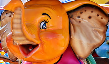 orange, red, ceramic, elephant figurine close-up photo, carousel, ride, elephant, colorful, year market, folk festival, fun