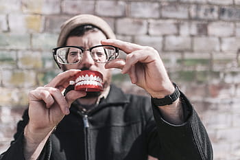 person holding eyeglasses, person, eyeglasses, whimisical, people, lazy, glasses, smile, teeth, happy, strange