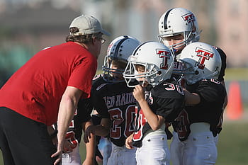 four, nfl players, staring, man, wearing, red, shirt, daytime, football coach, coaching, american