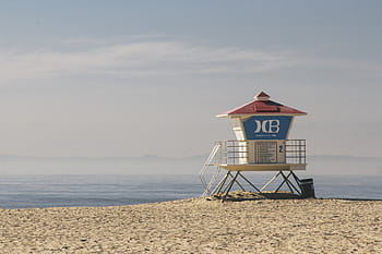 white, blue, lifeguard tower, beach shore, red, lifeguard, house, sky, ocean, water, beach