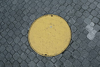 round, yellow, man hole, cover, frame, manhole, cobblestone, pattern, texture, textured, sport