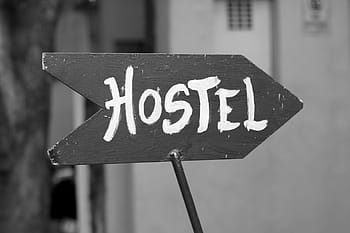 grayscale photography, wooden, hostel road signage, hostel, youth hostel