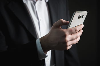 person, black, formal, coat, holding, samsung galaxy android smarpthone, email, business, smartphone, screen, pressing