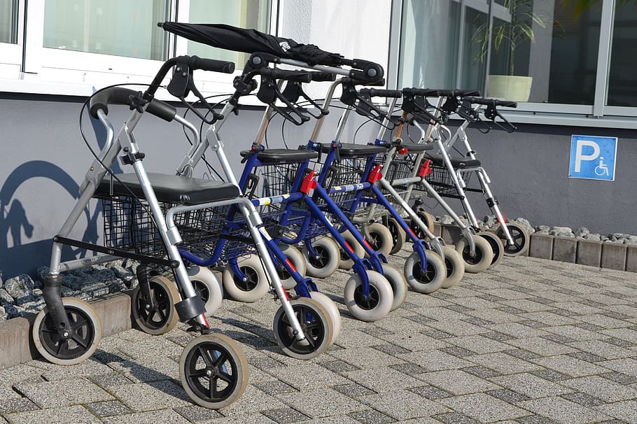 closeup, lined, white-and-blue rollators, gray, painted, wall, rollator, seniors, disabled parking space, walking aids, old people