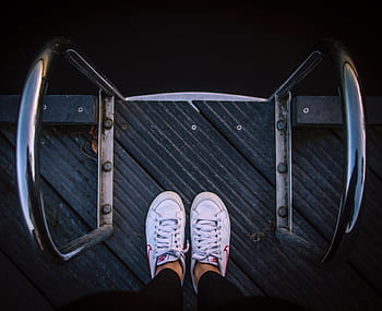 person, wearing, white, shoes, steel, handle, shoe, footwear, legs, directly above, one person