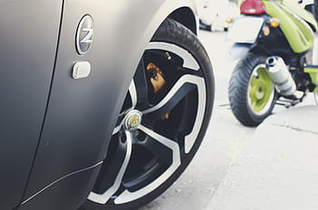 gray, vehicle, parked, sidewalk, grey, nissan, z, series, spoke, wheels, near