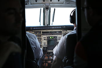 man piloting plane, two, pilots, airplane, cabin, cockpit, pilot, travel, transportation, trip, vehicle interior