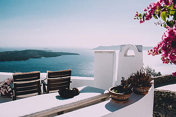 two, brown, plant pots, wooden, chairs, mountain, sea, ocean, water, building, resort