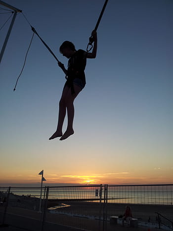 person in harness, Woman, Sport, Belt, Trampoline, jumping on a trampoline, action, elastic, norderney, beach, sea