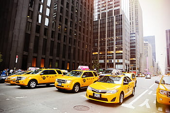 taxis, cabs, yellow, new york, city, street, road, buildings, towers, manhole, windows