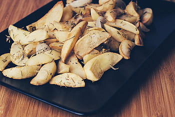 cooked, food, served, black, tray, brown, dish, top, plate, potatoes, wedges