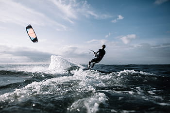 man, riding, surfboard, daytime, action, adventure, beach, clouds, fun, horizon, kite