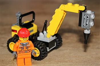 worker minifigure, heavy, equipment building block toy, placed, brown, surface, lego, toys, excavators, figure, building blocks