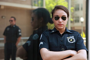 woman, black, suit, wearing, sunglasses, leaning, wall, bodyworn, body camera, police body camera, law enforcement