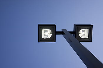 turned-on post lamp, blue, sky, daytime, post, lights, clear, lamp post, pole, low angle view, technology