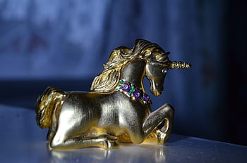 brass figurine, unicorn, closeup, photography, placed, white, table, brass, figurine, closeup photography, ornament