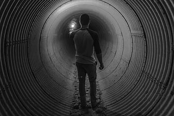 person, standing, inside, tunnel, grayscale, man, guy, flare, light, people, black and white