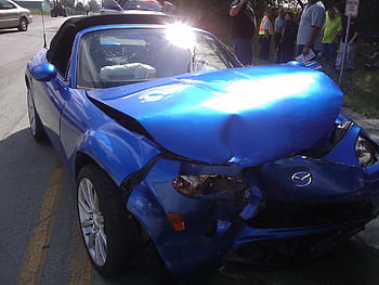 wrecked, blue, mazda coupe, highway, daytime, car, accident, crash, crashed, smash, smashed